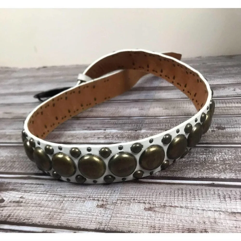 White leather with brass accents